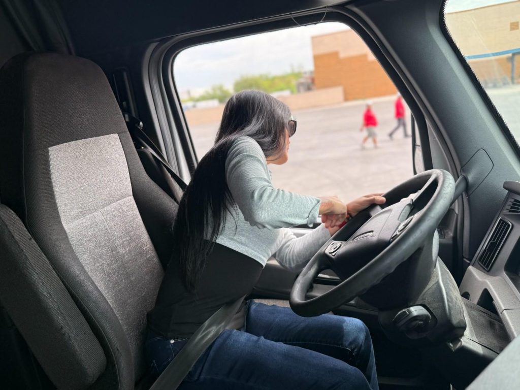 Woman CDL student behind the wheel during behind-the-wheel truck driver training at Southwest Truck Driver Training