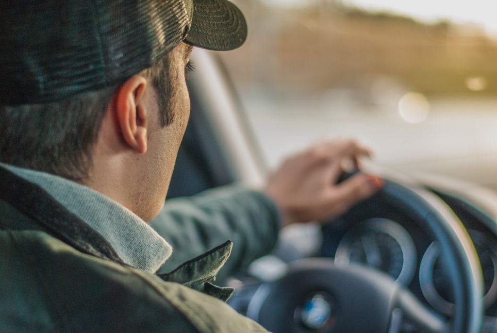 Driver behind the wheel on the road