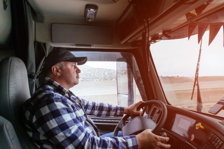 CDL truck driver behind the wheel on a long-haul route