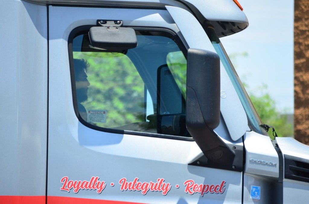 Close-up of a semi-truck cab door with Loyalty Integrity Respect motto in Tucson Arizona