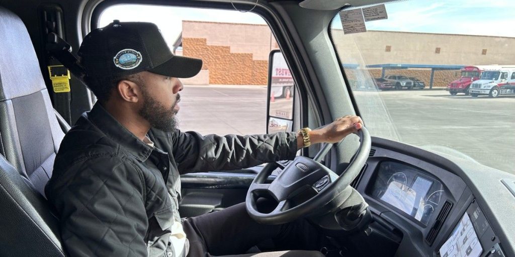 CDL truck driver behind the wheel of a semi-truck cab at Southwest Truck Driver Training
