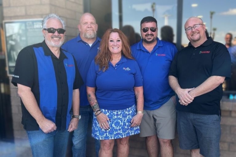 Gina Jones and Southwest Truck Driver Training staff smiling