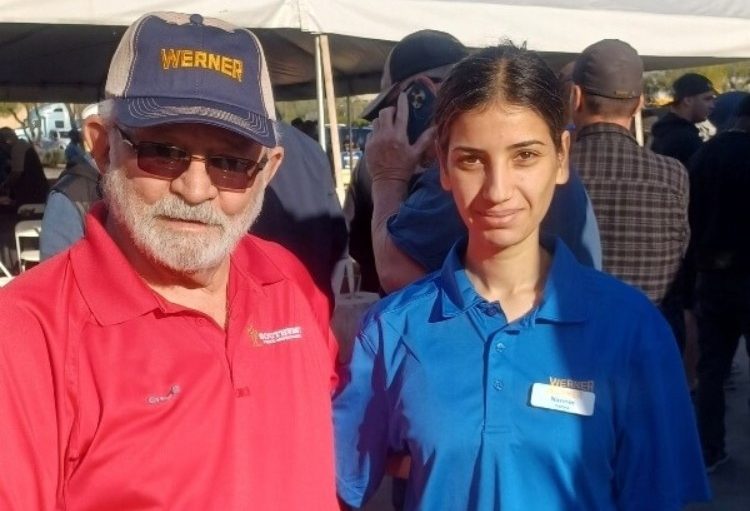 Narmin Hanna smiling and standing next to a Southwest Truck Driver Training employee