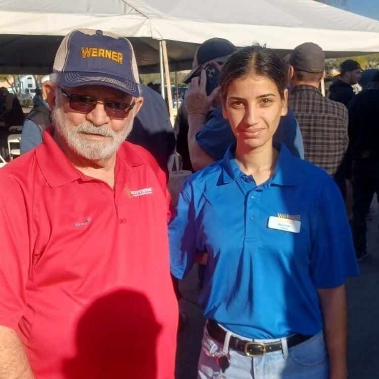 Narmin Hanna smiling and standing next to a Southwest Truck Driver Training employee