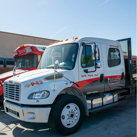 Front of Southwest Truck Driver Training truck cab with a flatbed trailer attached