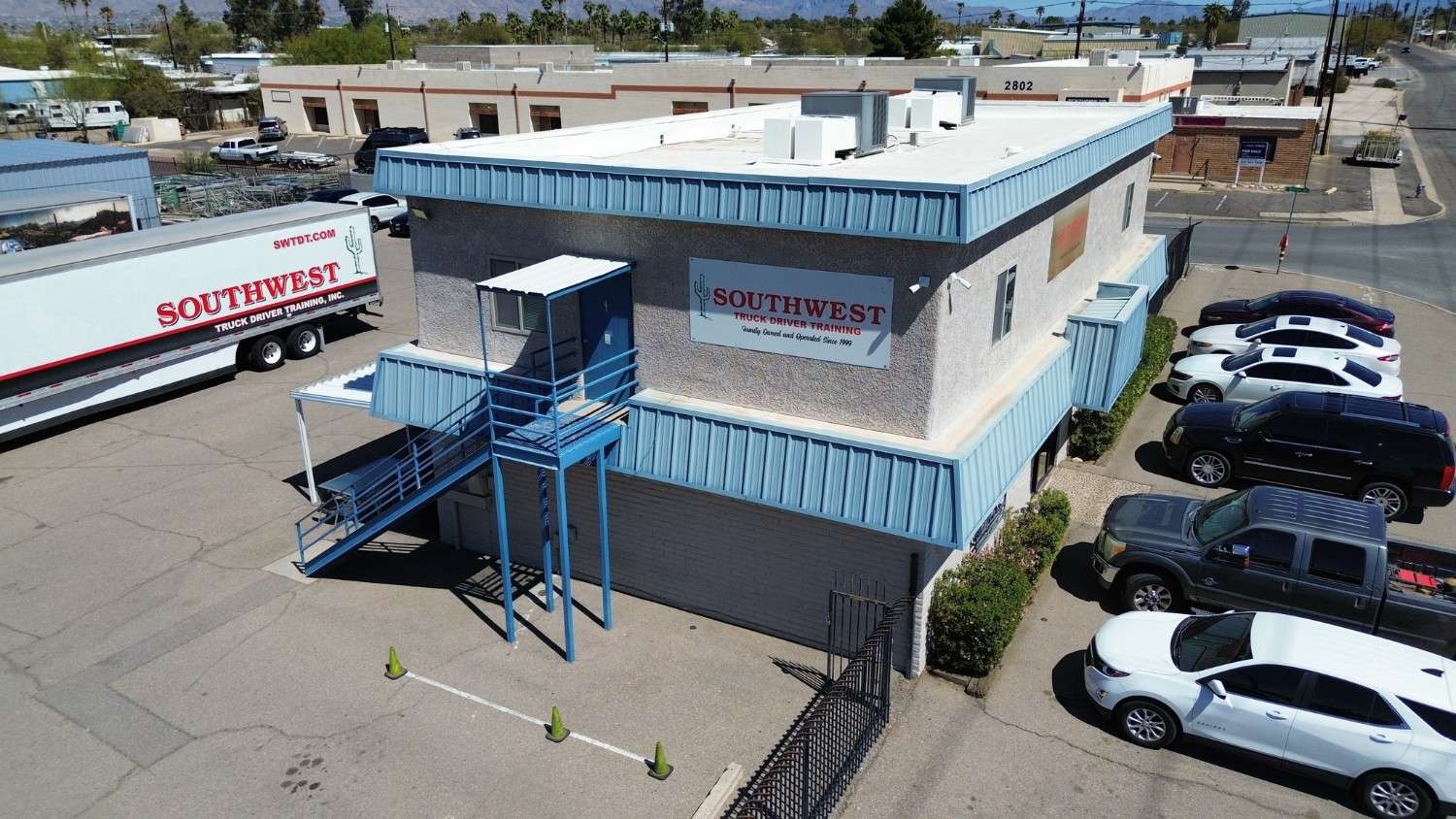 Drone view of Tucson campus building and parking lot