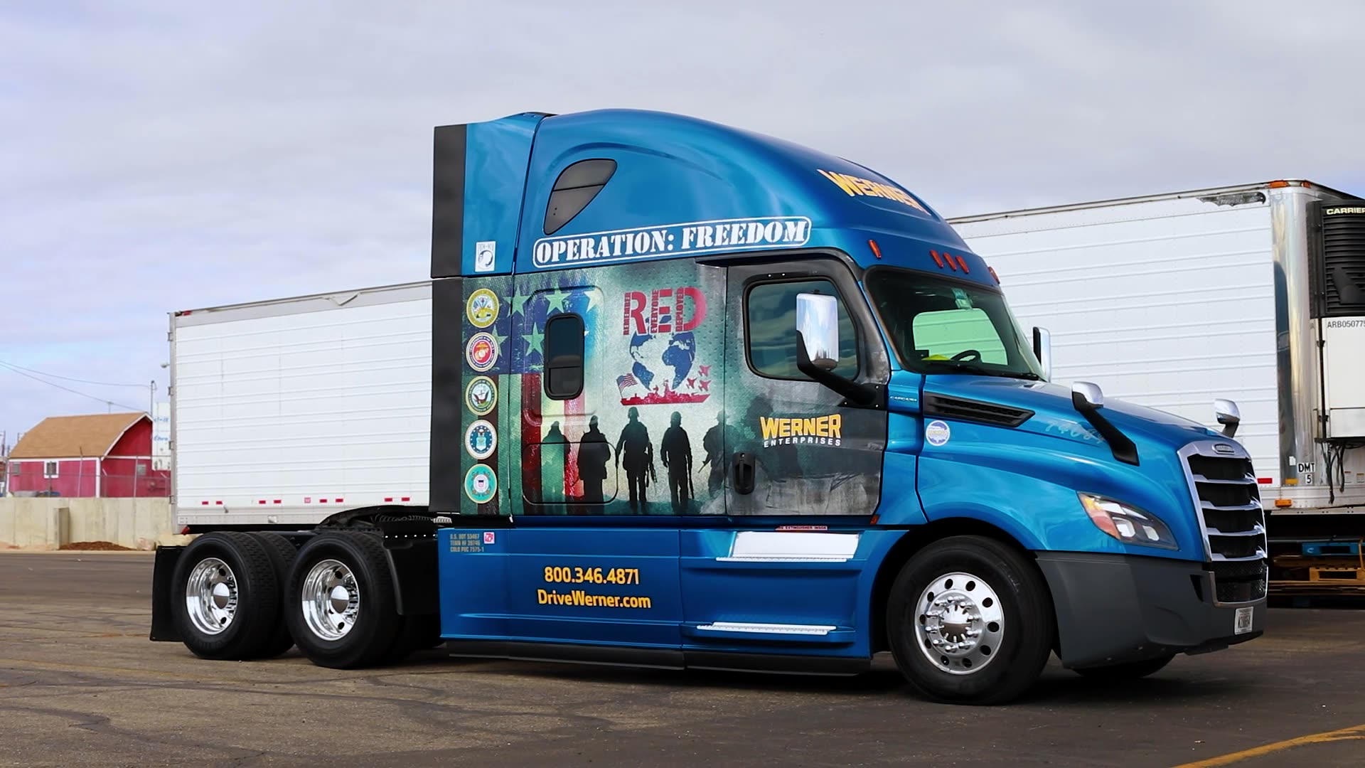 Werner Enterprises semi truck cab with "Operation Freedom"