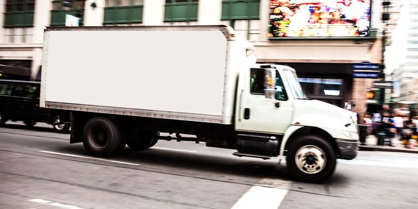 Truck in the night in New York streets, USA.